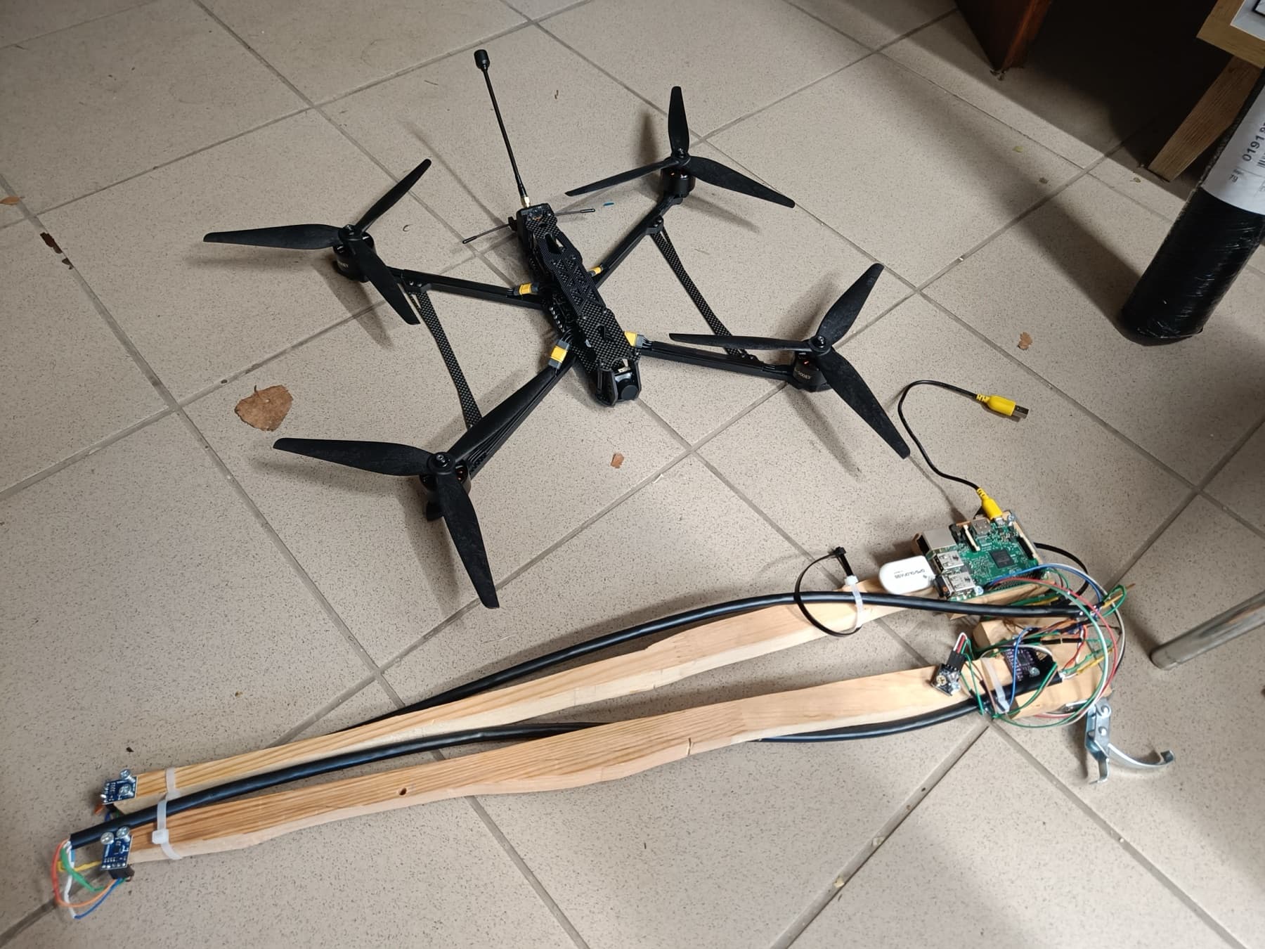 Iron-detector payload beside the large quadcopter used to carry it